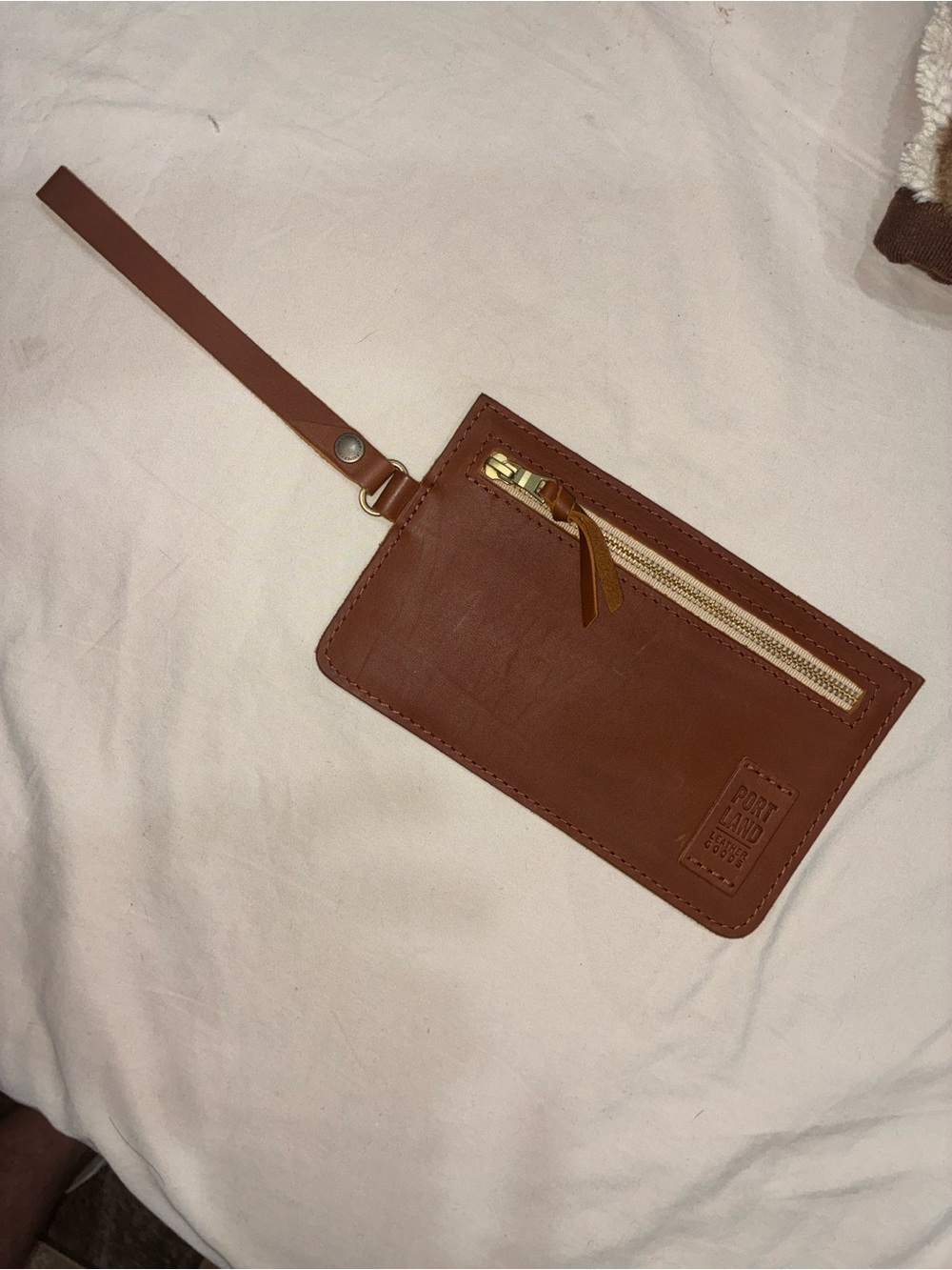 Portland Leather Goods brown leather wristlet zipper pouch with removable strap